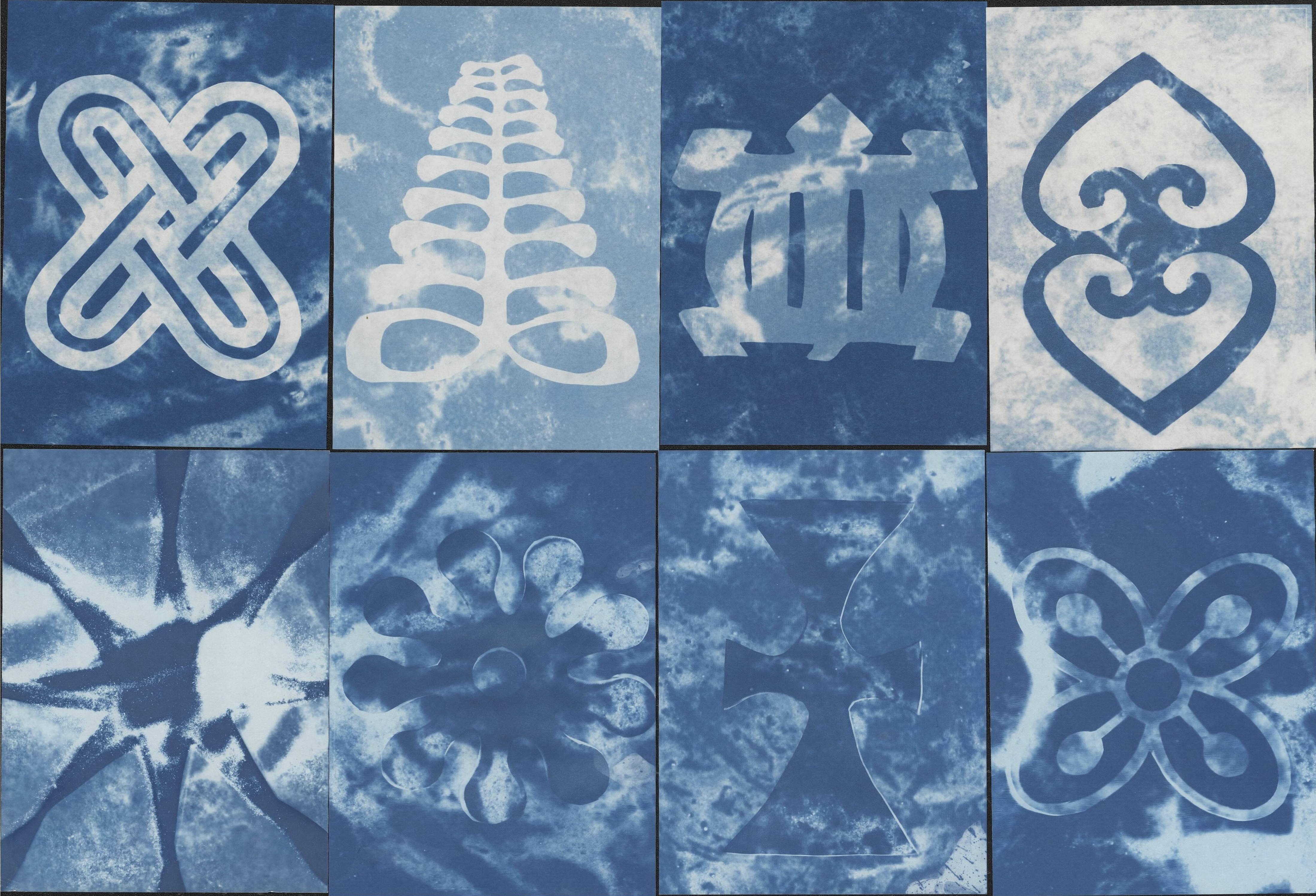 concrete face with cowrie shell eyes